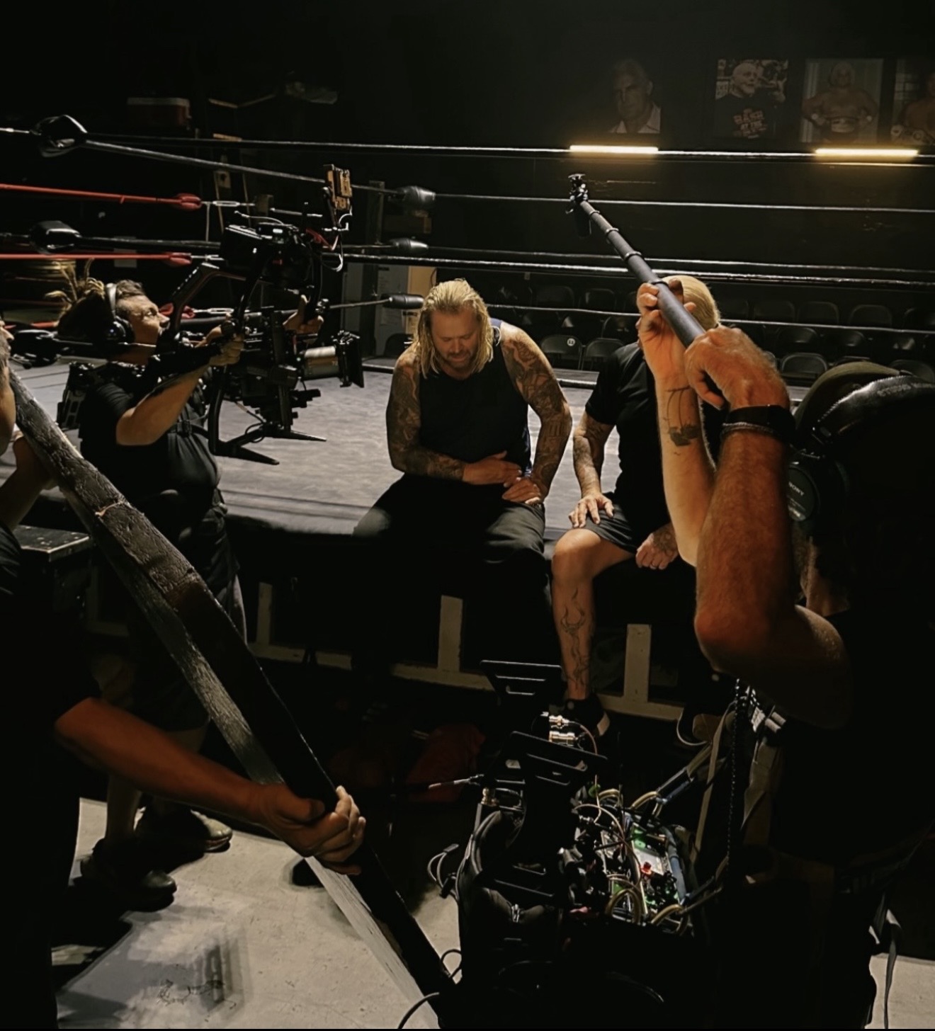 Camera and sound crew filming beside the wrestling ring